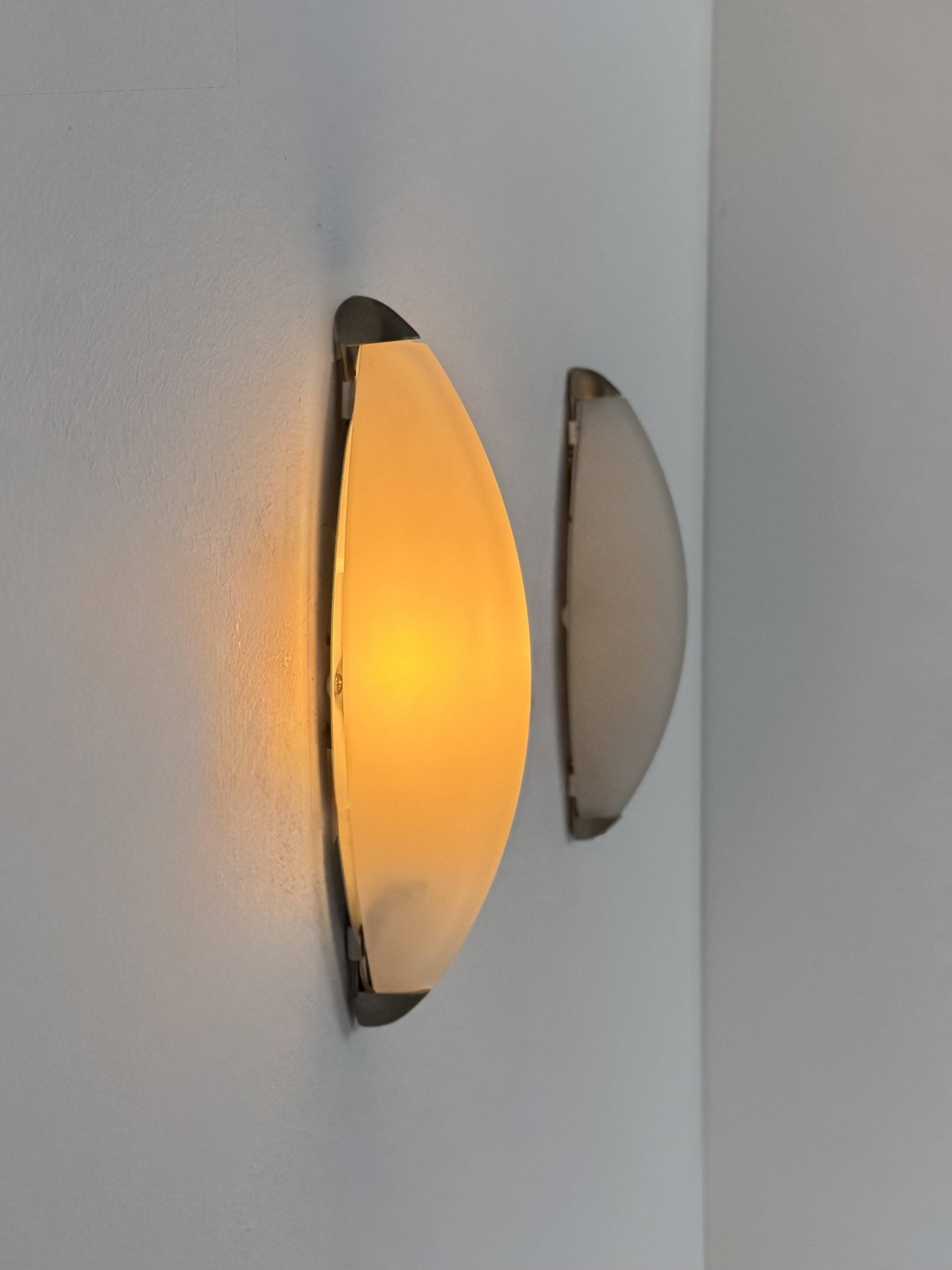 Vintage wall lights, chrome metal and frosted glass, France, 1970.