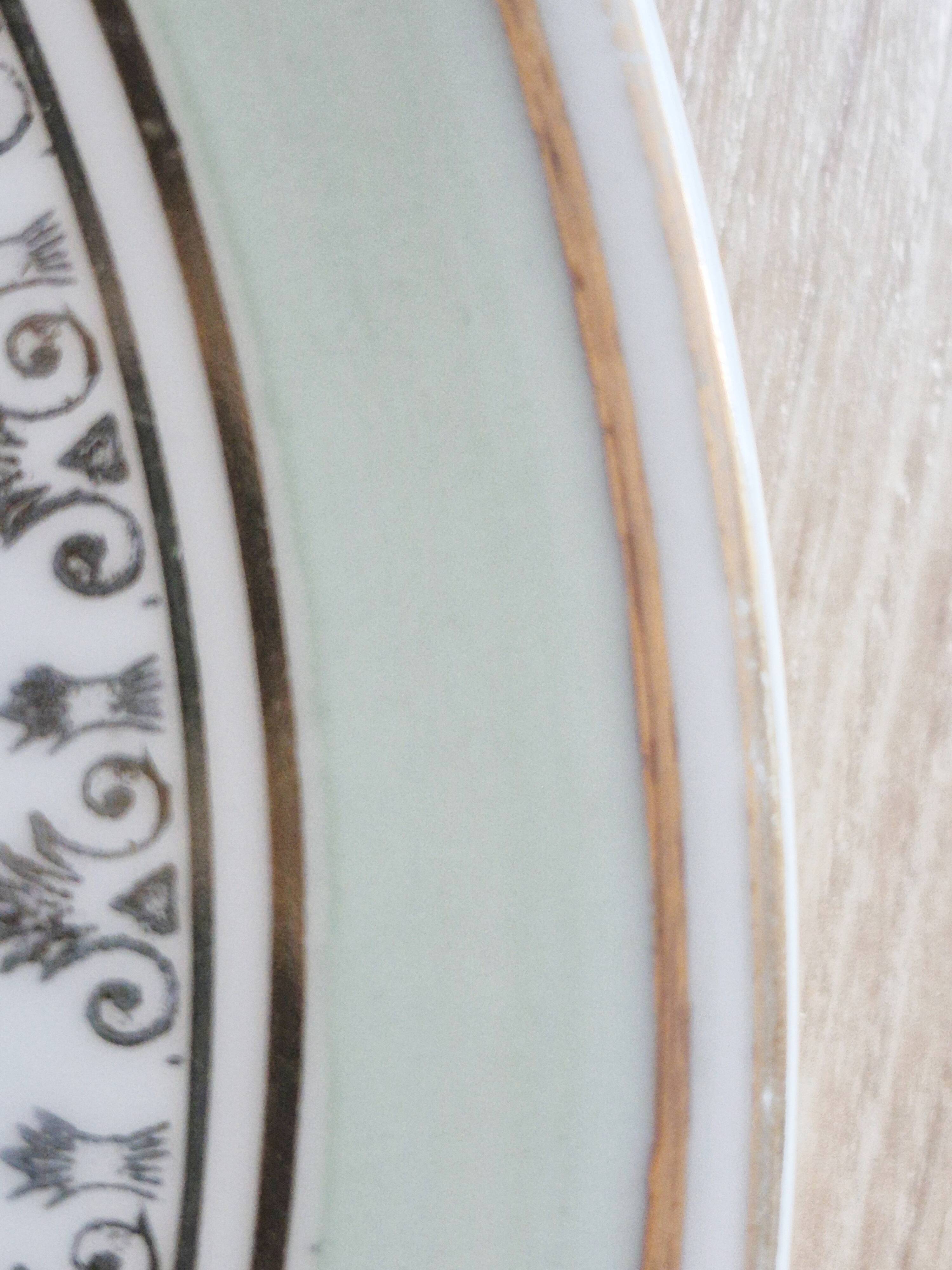 French porcelain dessert plates, green and gold.