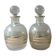 Pair of glass whiskey decanters with gold edging