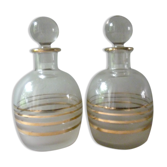 Pair of glass whiskey decanters with gold edging