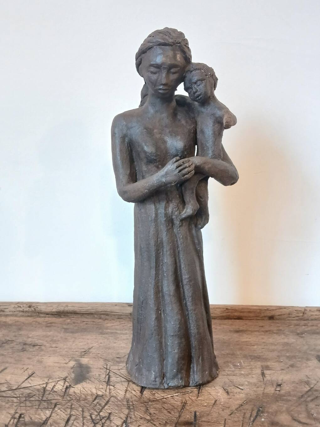 Sculpture representing a woman holding a child - original terracotta