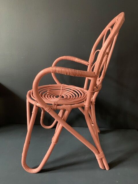 Vintage pink rattan armchair