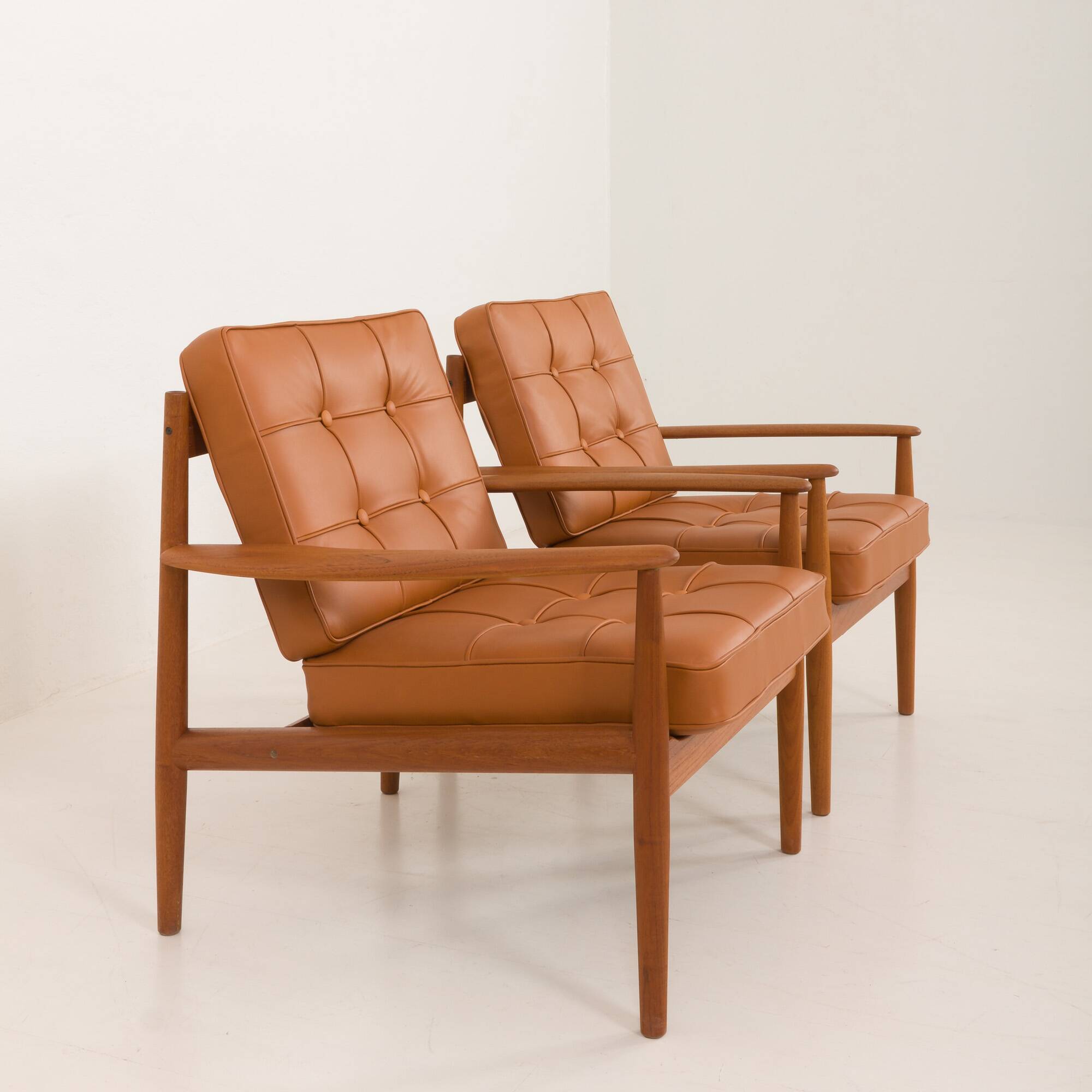 Rare Grete Jalk teak lounge chairs in aniline cognac leather for Cado