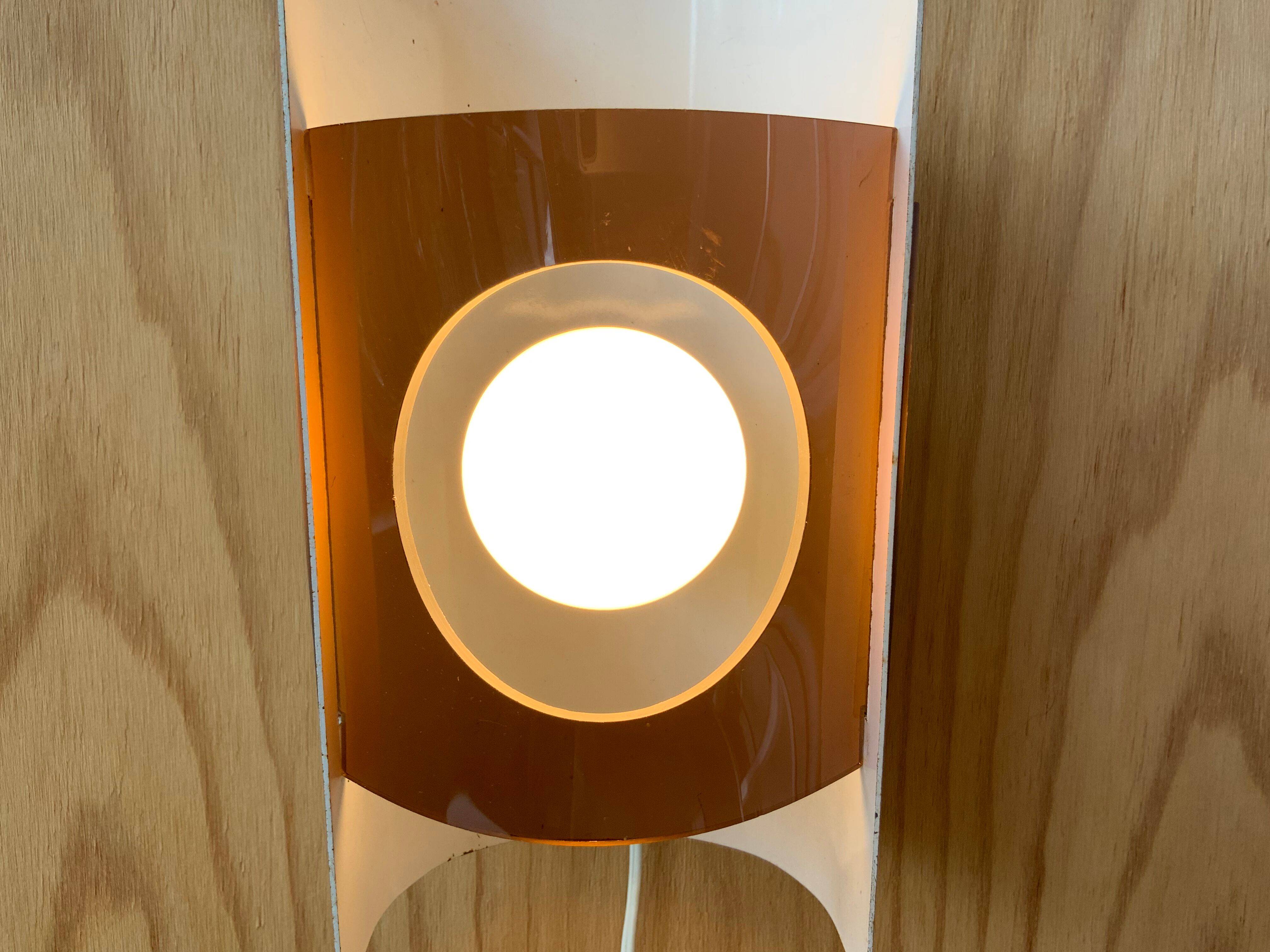 Plexiglas and metal wall lamp