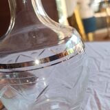 Blown glass decanter, engraved and chiselled. Made in France.