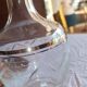 Blown glass decanter, engraved and chiselled. Made in France.