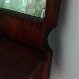 Wooden wall mirror with its shelf