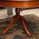 Circular table in solid mahogany and black leather claw base Restoration