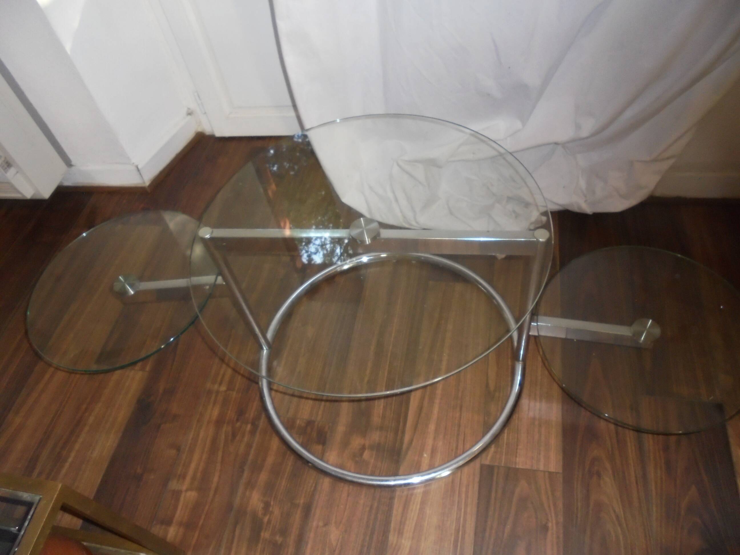 Glass coffee table with swivel tops circa 1980