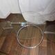 Glass coffee table with swivel tops circa 1980