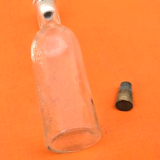 Embossed graduated apothecary bottle 1950's