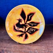 Terracotta plate, Jean Lurçat decorated with a rooster and foliage.