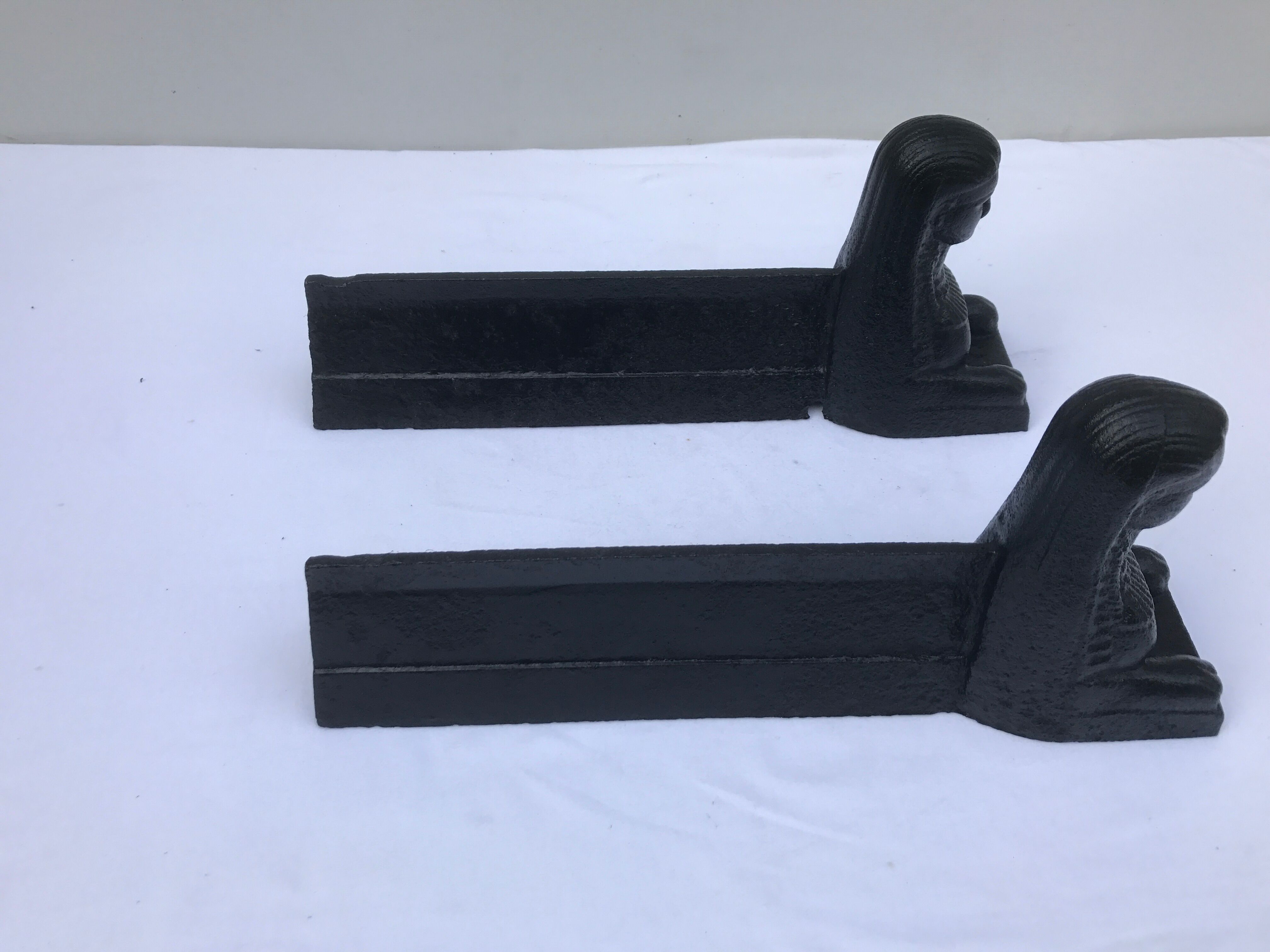 Former Egyptian cast-iron chenet in vintage black metal