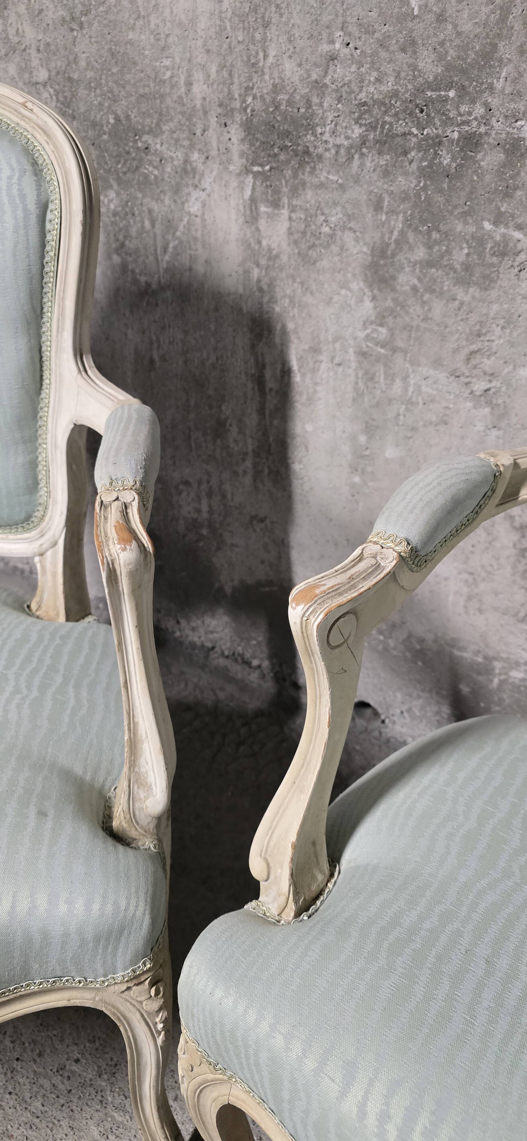 Pair of Louis XV style armchairs in patinated wood, light blue fabric.