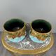 Paire de cache-pots en barbotine à décor de mascarons, XIXe siècle