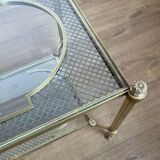 Rare bronze, brass, and steel mesh coffee table with a double glass top resting on a brass mesh. French work by Jansen