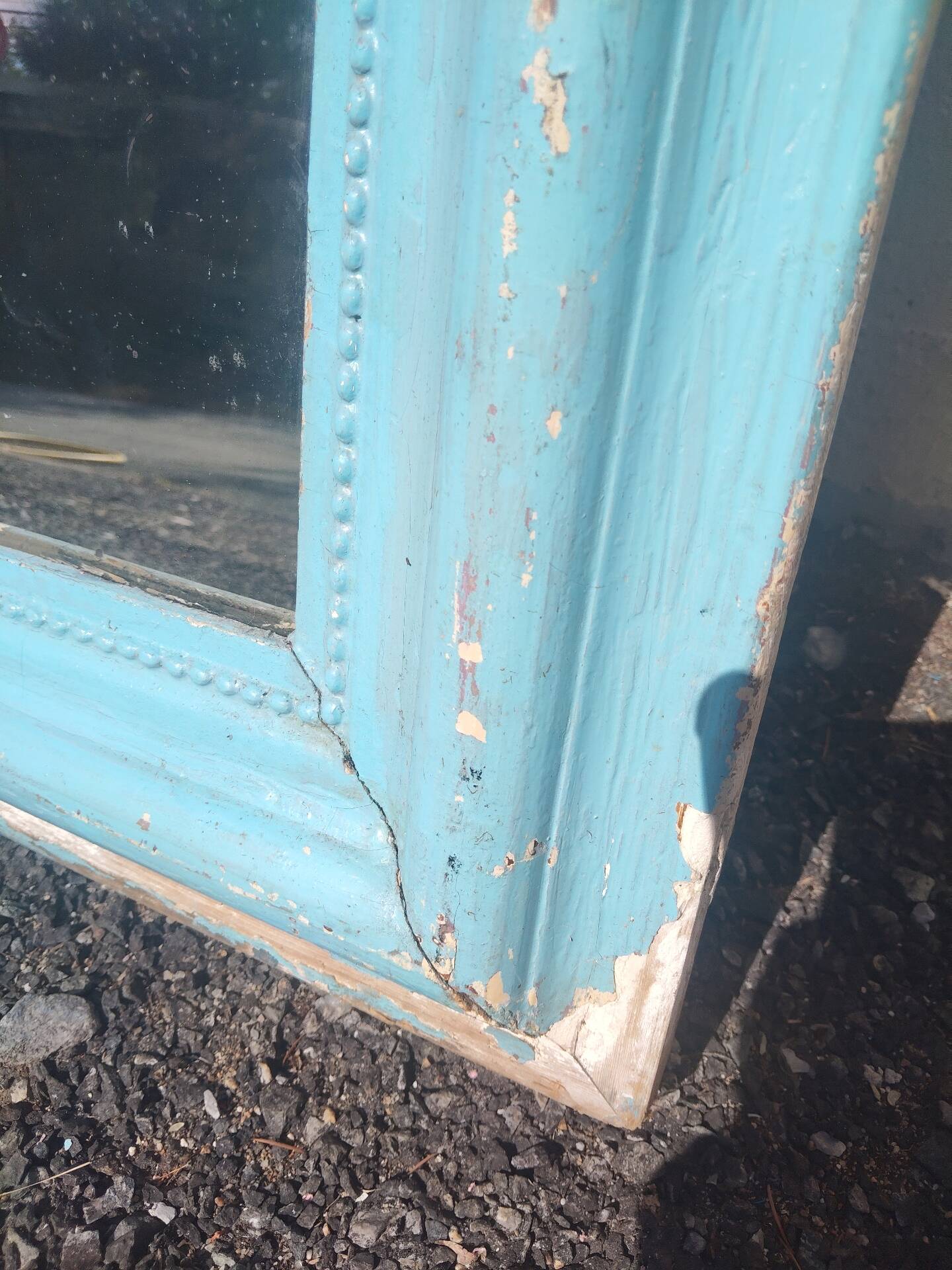 Large Louis-Philippe mirror from the 19th century in wood and stucco with a turquoise blue patina.