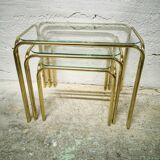 Trio of nesting tables in gold metal