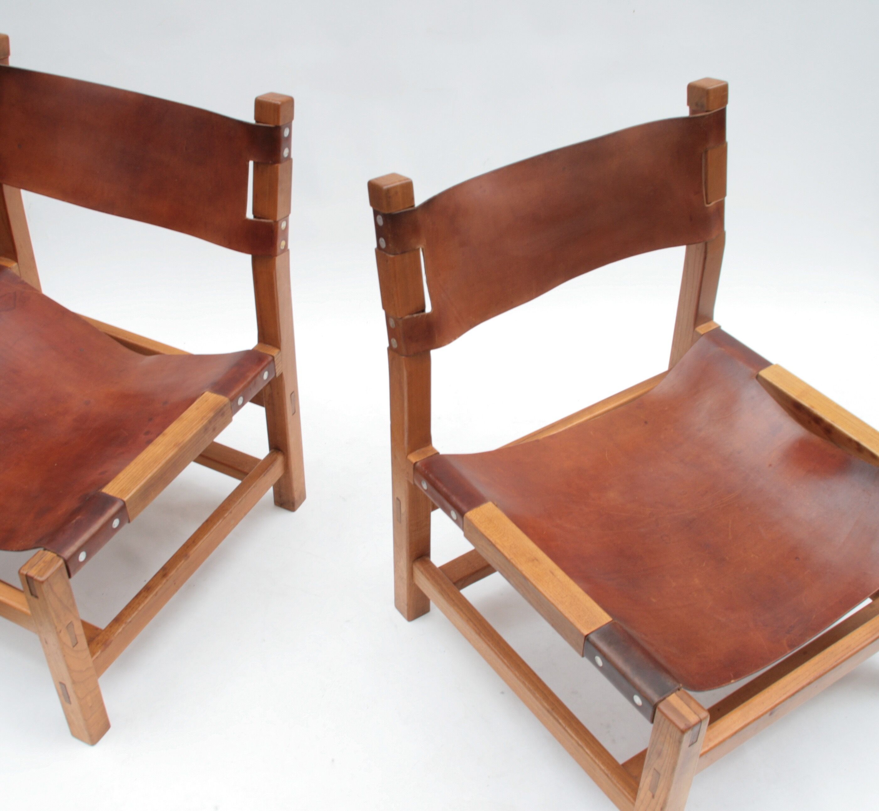 Pair of elm and leather heaters by Maison Regain, 1960s