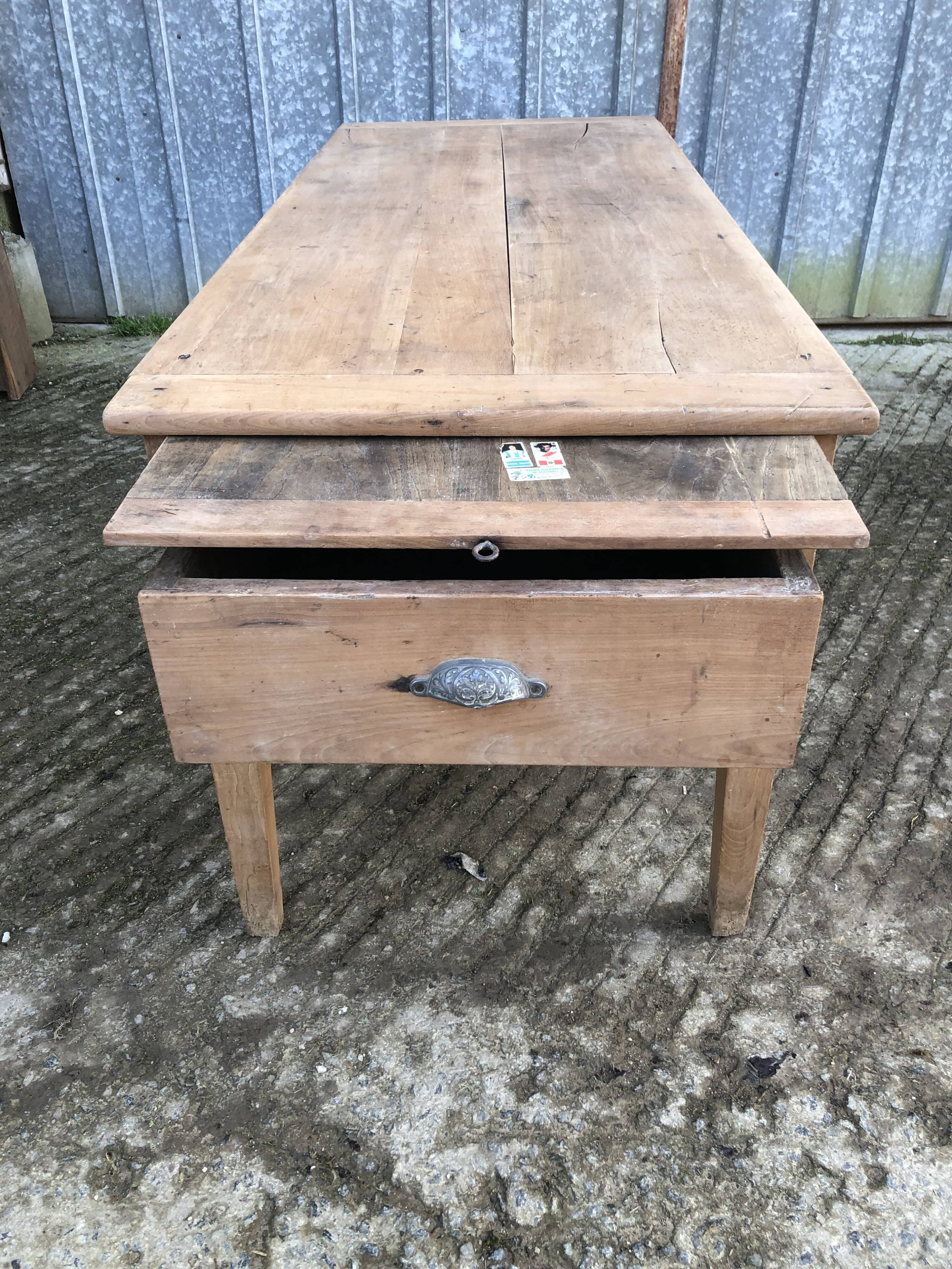 Antique solid cherry farmhouse table with 3 drawers and 1 pull out.