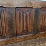 Oak church bench period XVII th century, back decorated with carved parchments