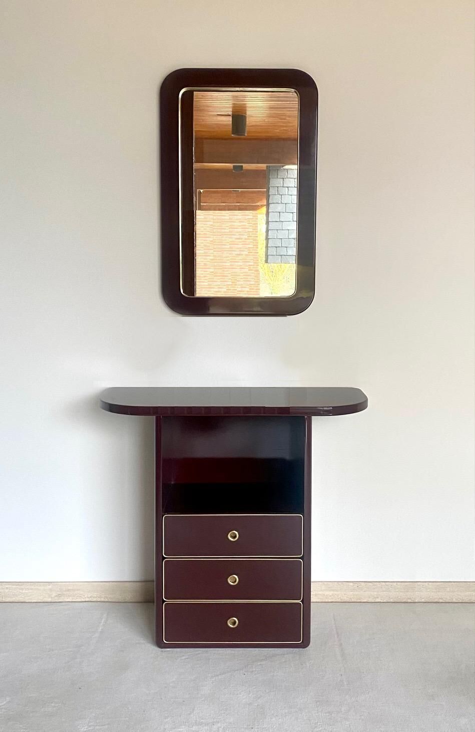 Chest of drawers and mirror in burgundy lacquer, 1980