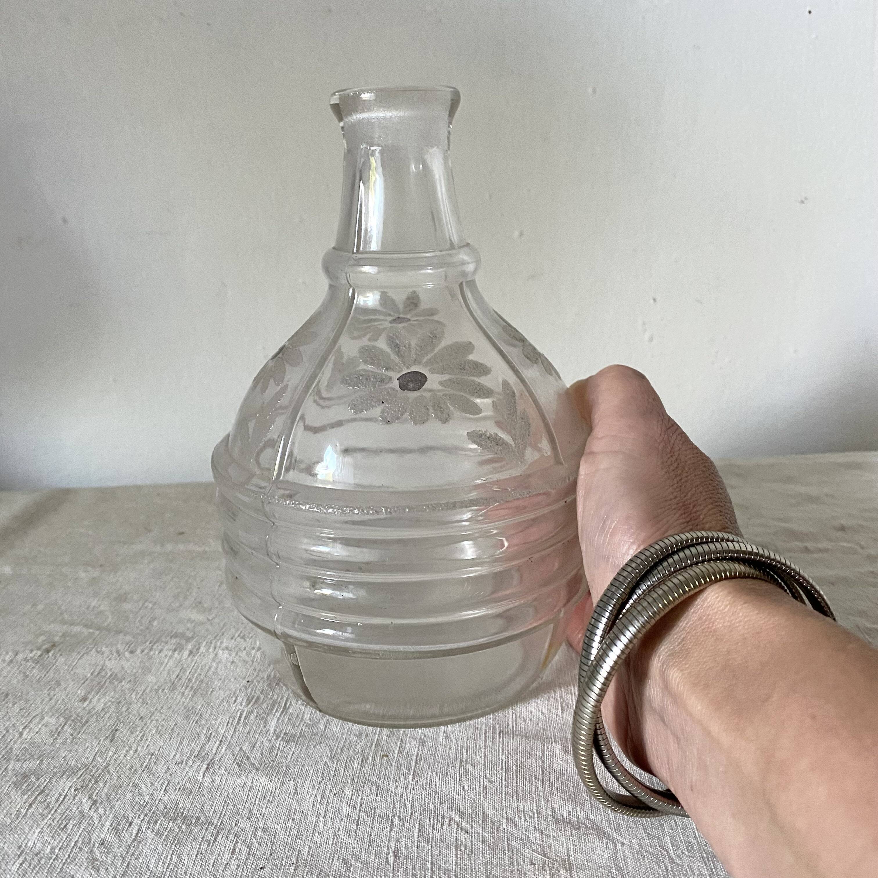 Antique carafe, daisy-decorated vase