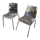 Pair of smoked polycarbonate chairs