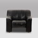 Maison De Sede. Armchair and its ottoman in black leather. 1970s.