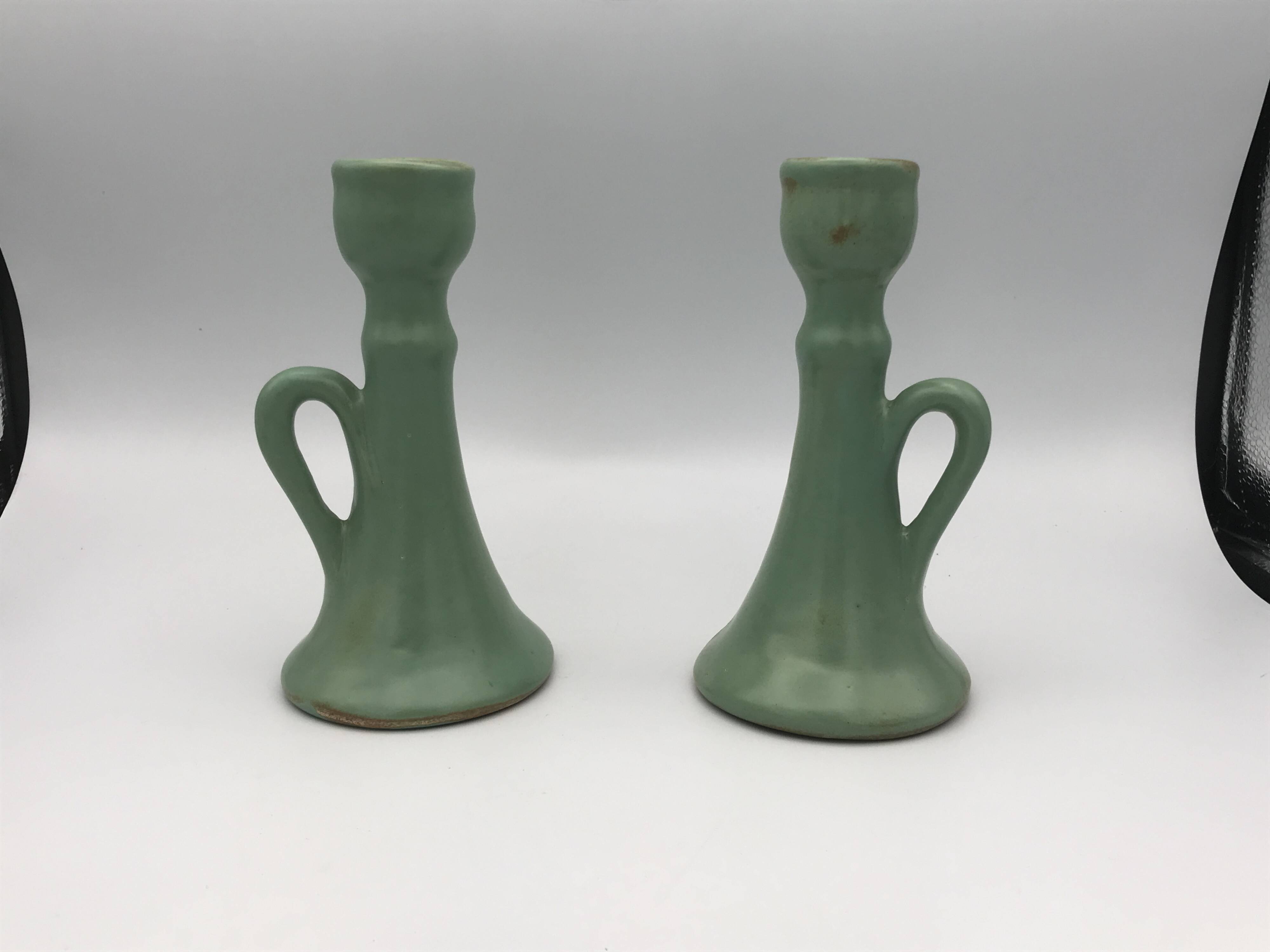 Pair of vintage table candle holders in green enameled ceramic