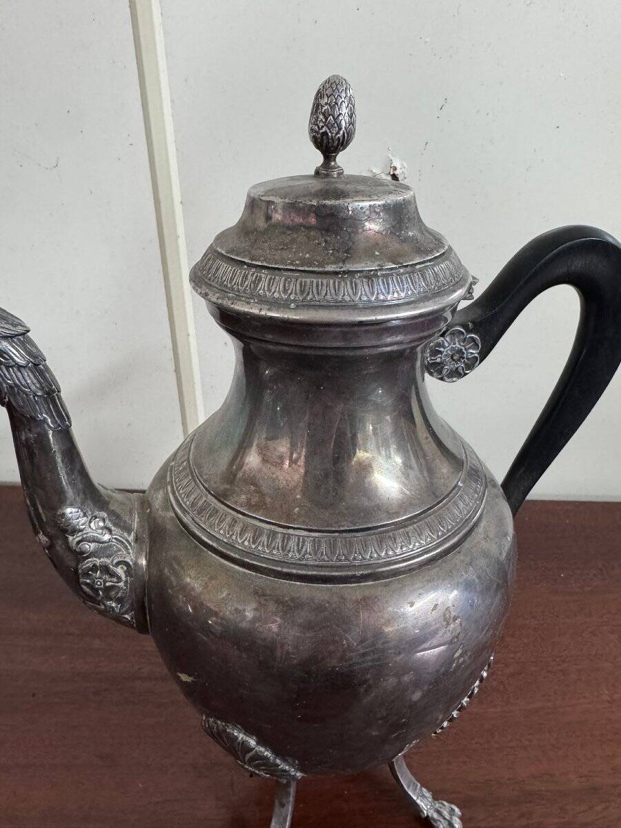 Empire style silver-plated verseuse, resting on three sculpted feet.