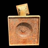 Bronze candle holder with floral motifs.