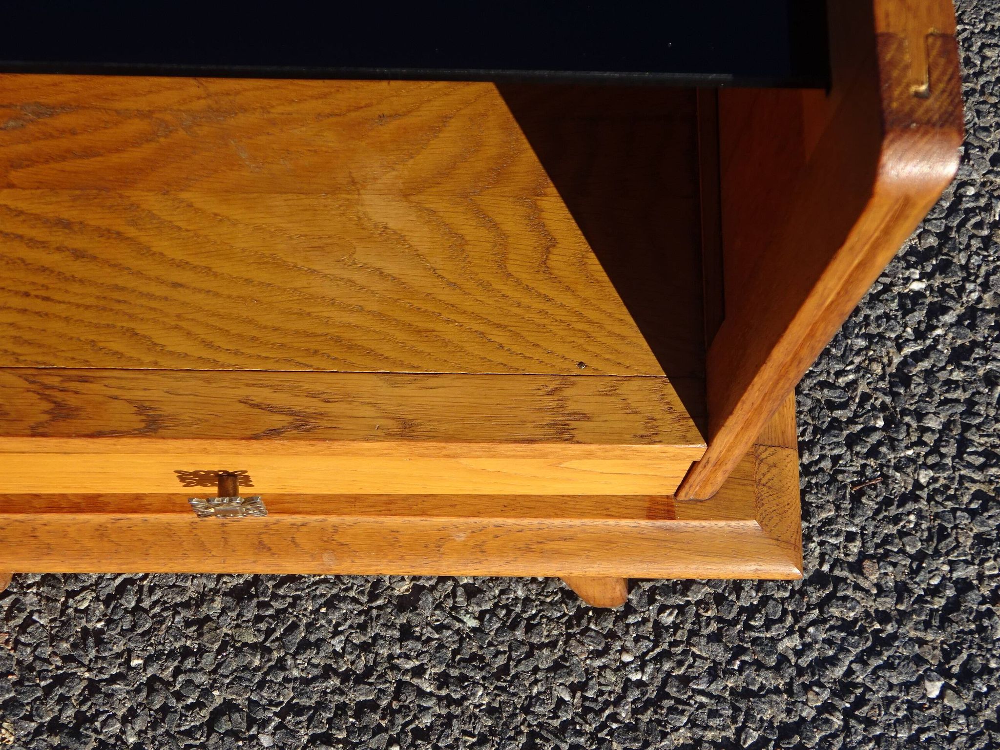 Vintage oak bedside table with tapered legs.