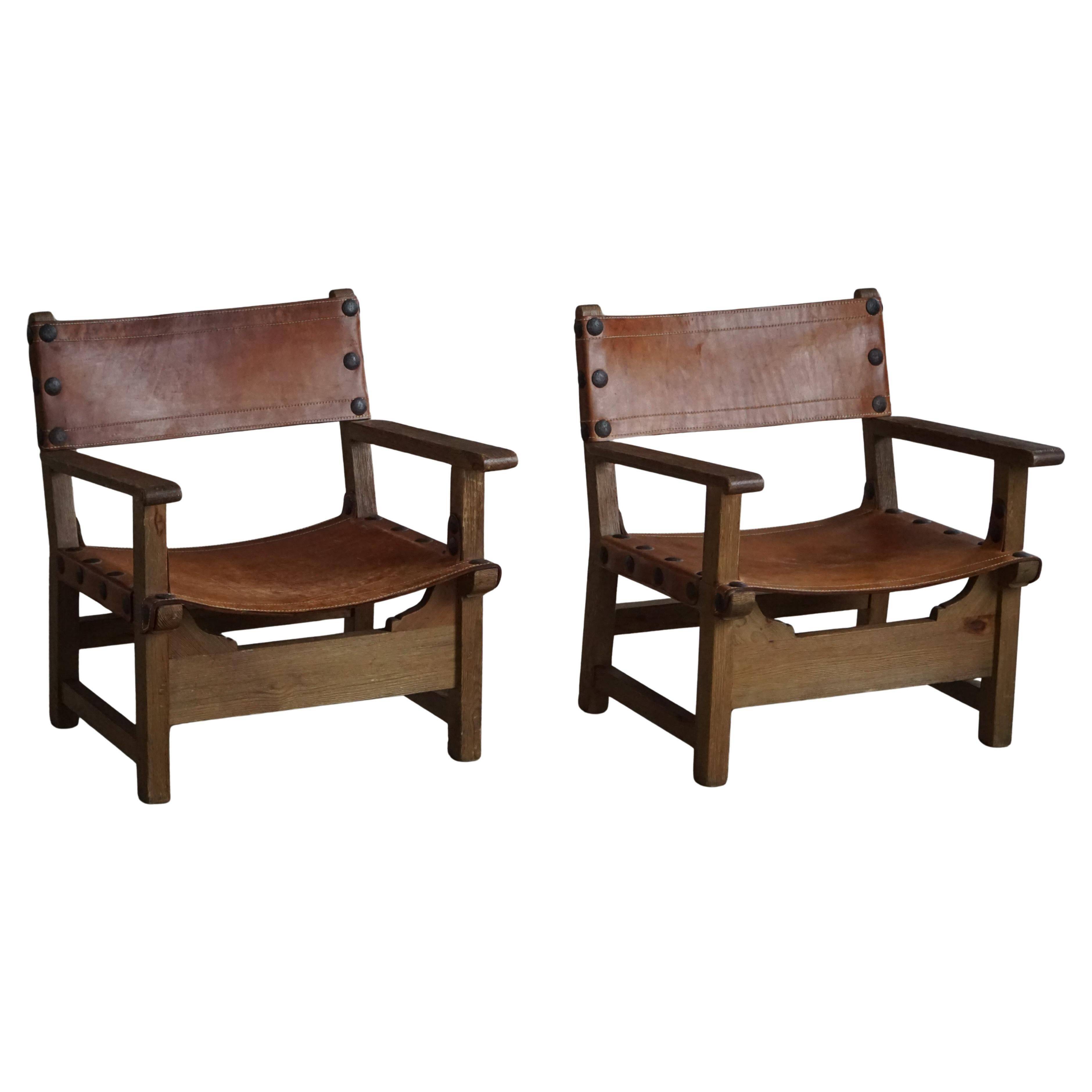 Pair of Spanish brutalist armchairs from the 1960s, wood and leather.