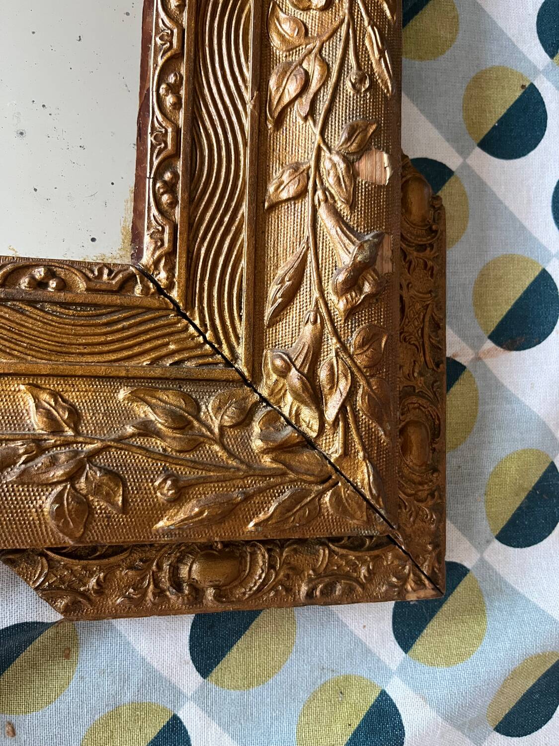 Golden trumeau mirror for fireplace, late 19th century, with sculpted pediment.