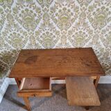 Old wooden desk with bars