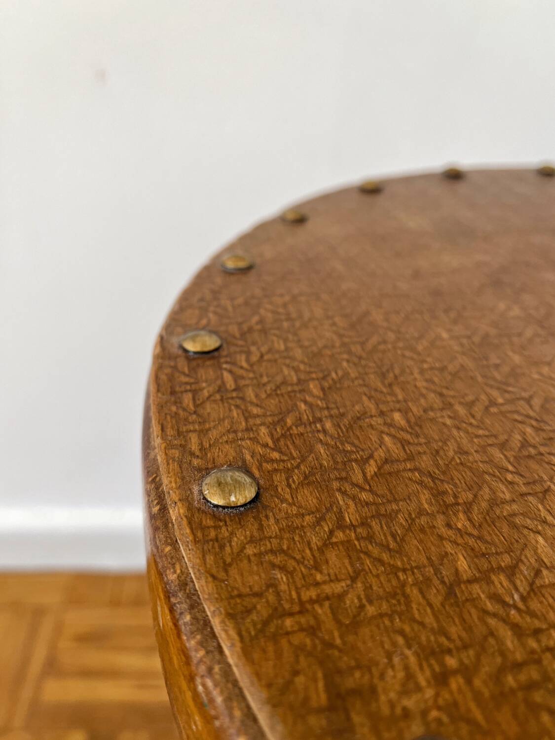 2 antique bistro stools with curved wood and caning effect.