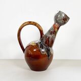Large bird jug with high neck and handle, signed under the base
