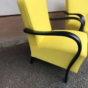 Pair of yellow Art Deco armchairs in cotton and wood, black frame, 1920s.
