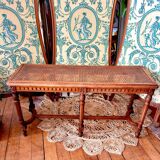 Piano bench seat in cane