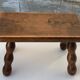Footstool in varnished wood turns old