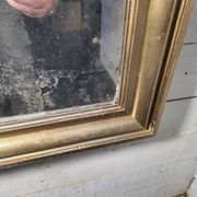 Golden mirror in oak from the 19th century.