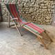 Red and green striped wooden deckchair