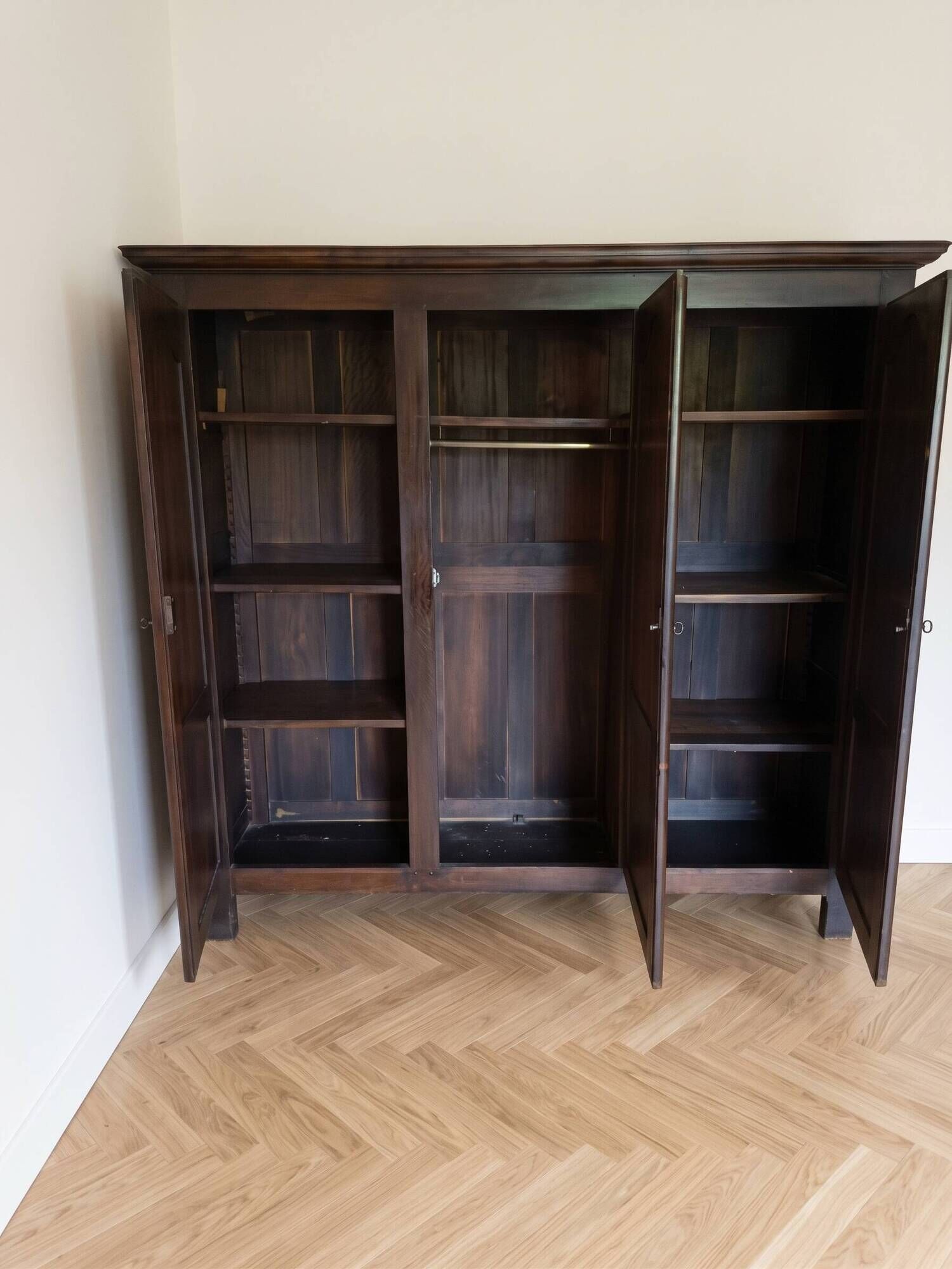 Large antique wardrobe with 3 doors made of solid wood.