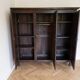 Large antique wardrobe with 3 doors made of solid wood.