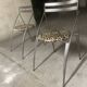 Pair of folding chairs from the 80s with leopard print seats.