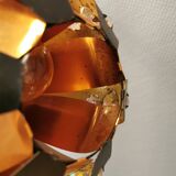 Hanging lamp in thin metal pieces, copper colored and black with prisms.