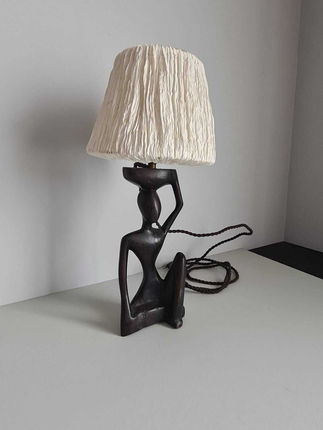 Ebony lamp with seated woman / 1930s