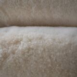 Womb Chair and Ottoman in fluffy white fabric by Eero Saarinen