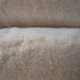 Womb Chair and Ottoman in fluffy white fabric by Eero Saarinen